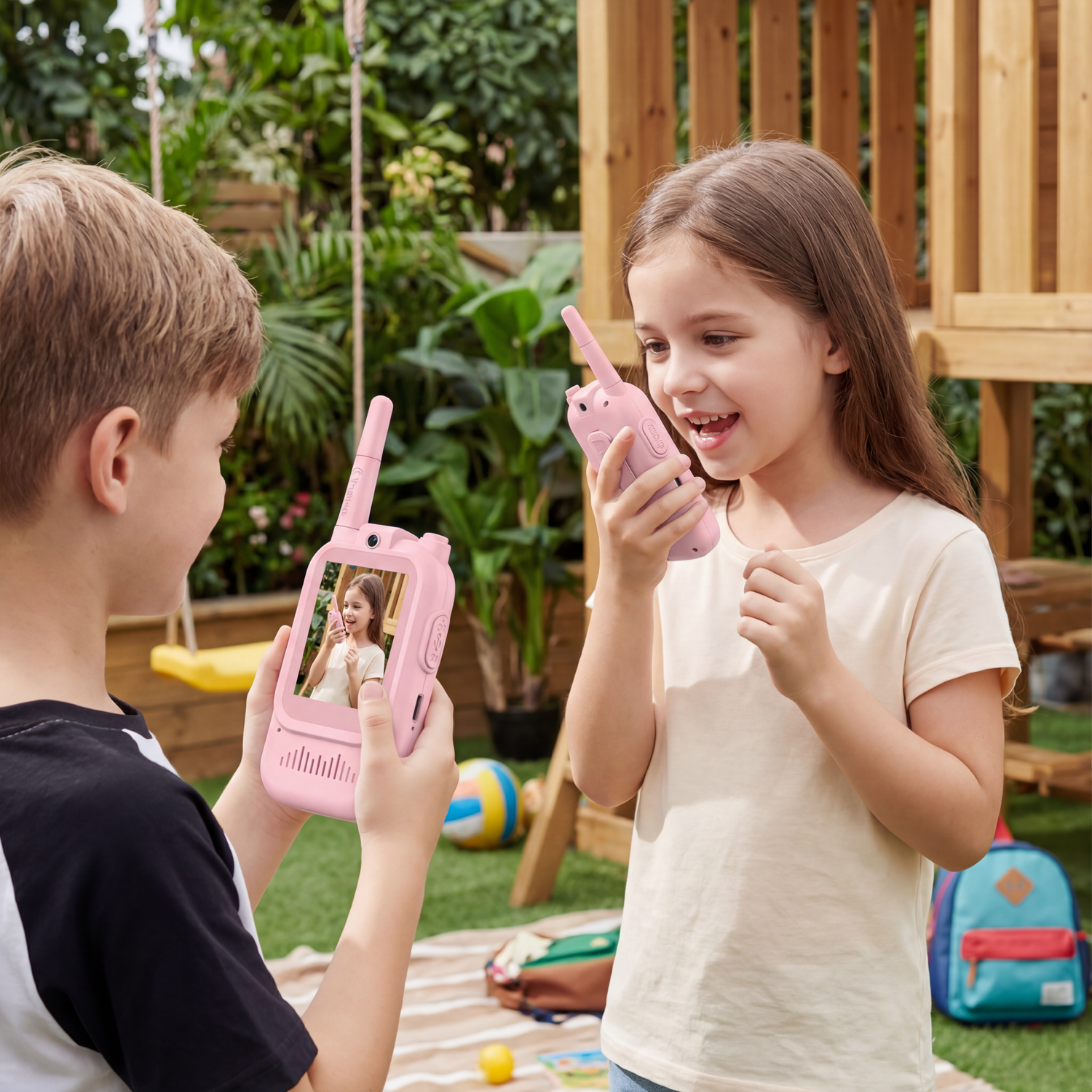 Children playing together with video walkie talkies