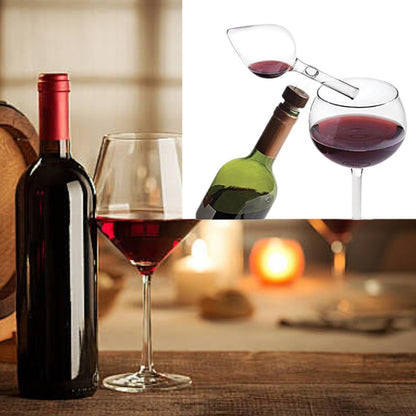 Glass wine aerator pouring red wine beside an elegant wine glass