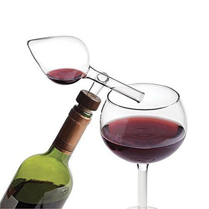 Glass wine aerator in use while serving red wine